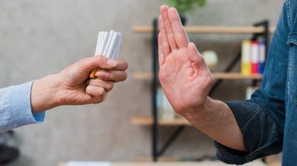 man-refusing-bunch-cigarettes-offered-by-his-female-friend