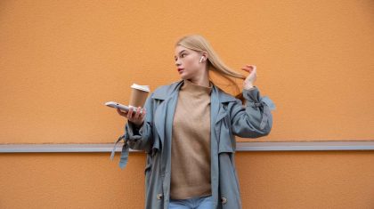 medium-shot-woman-holding-coffee-cup